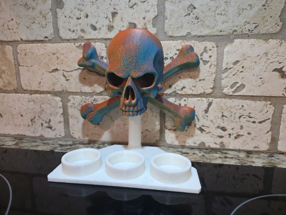 Schnapsglas-Halter Totenkopf mit Knochen
