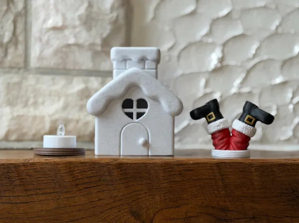Lichthaus Weihnachtsmann steckt im Kamin