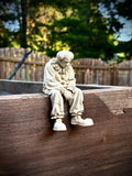 Figur Clown traurig Kantenhocker