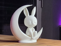 Niedlicher minimalistischer Kawaii-Hase auf dem Mond sitzend Figur Deko